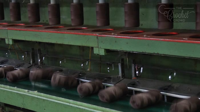 Yarn is Pushed Off Rollers and Falls Onto Conveyor to Ball Banding Station