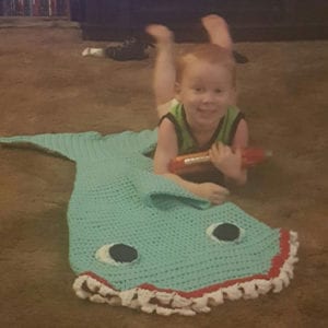Chase, 3 Year Old Toddler showing off his new Mini Crochet Shark