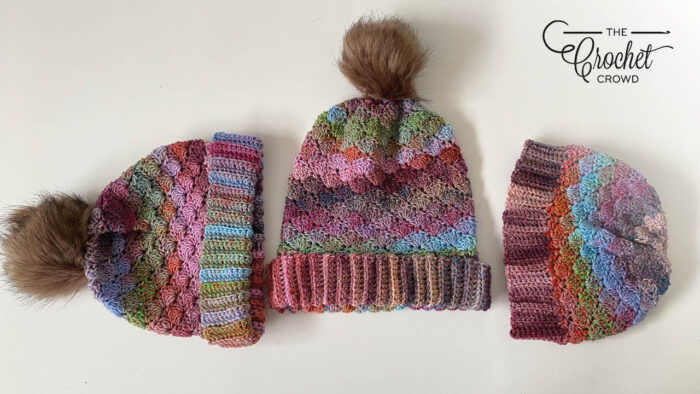 Three crocheted crowd hat in the group