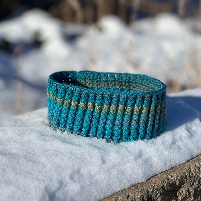 Crochet Unforgettable Headband Pattern on Snow