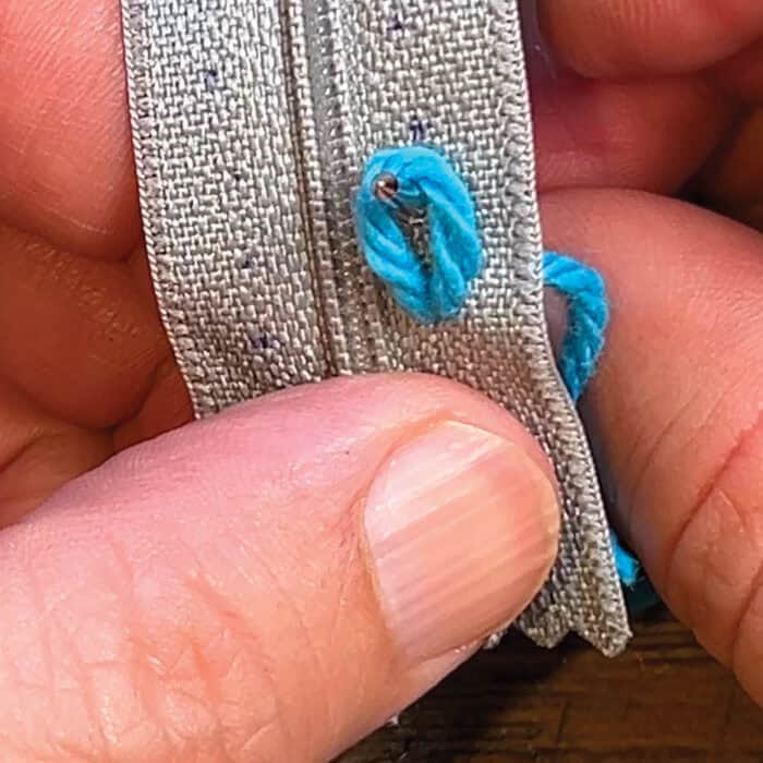 Attach Zipper to Yarn - Come up through Next Hole from Back and Through Middle Loop that Exists Before