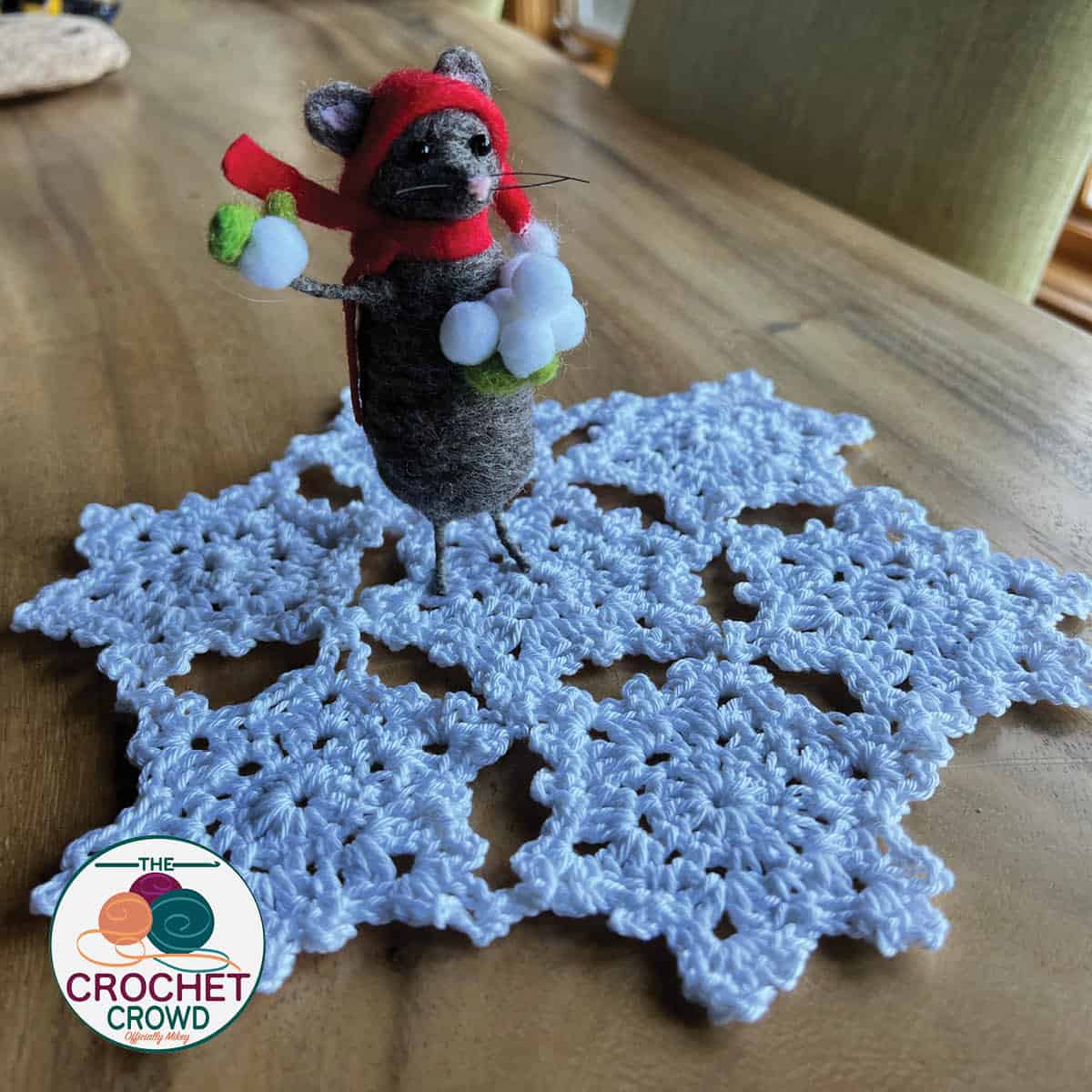 Crochet Snowflake Doily Pattern on Table with Mouse