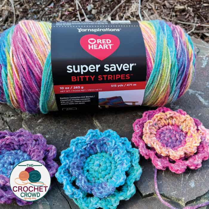 Crochet Red Heart Super Saver Bitty Stripes in Unicorn Maine Colour with Crochet Unicorn Flowers