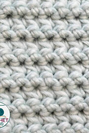 Thick white chunky yarn for crocheting or knitting projects.