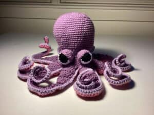Colorful amigurumi purple octopus crochet toy for crochet lovers.