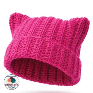 Bright pink crochet boot cuffs for winter fashion.